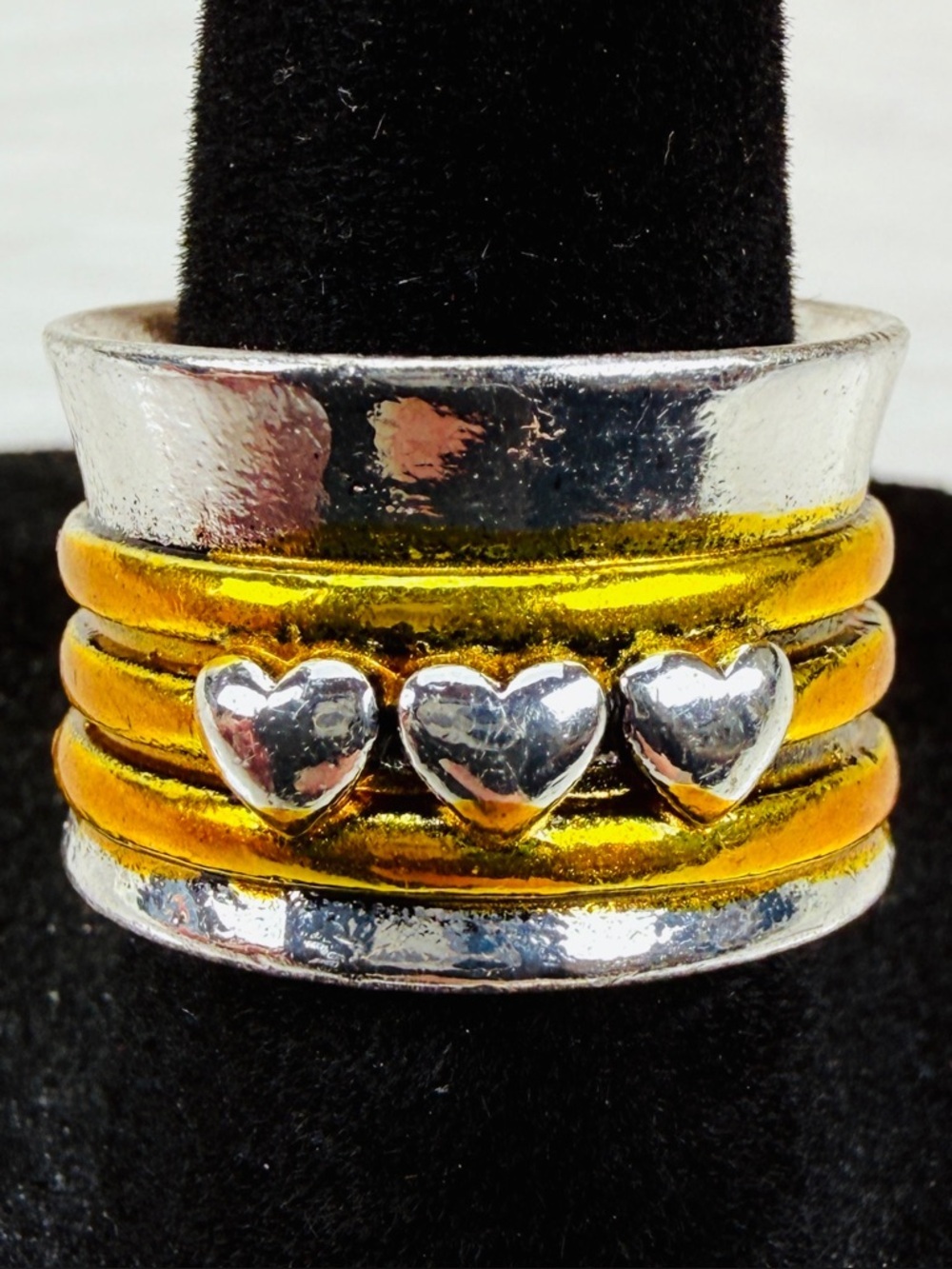 Goldtone and silvertone size 6, wide band heart accent statement ring
